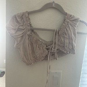 Garage cropped tan short sleeve top with adjustable ties in the front